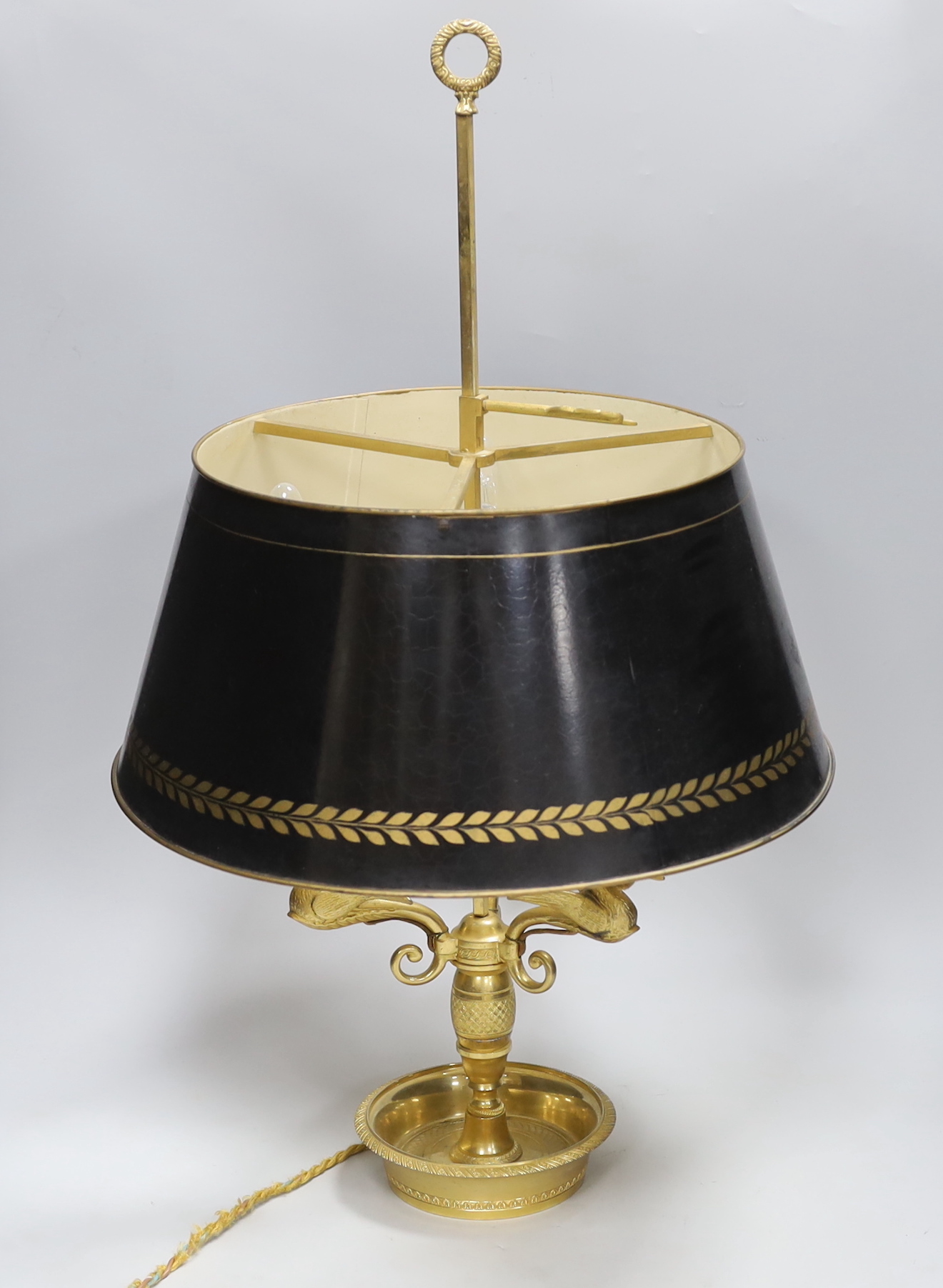 A Regency style gilt three light swan branch and toleware shaded table lamp, 65cm high